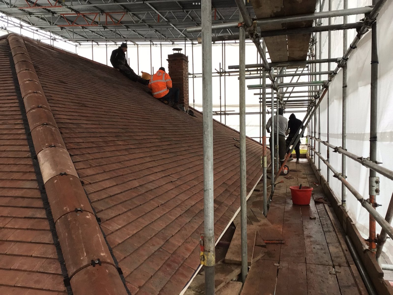 Re-roofing work in progress on an Essex property