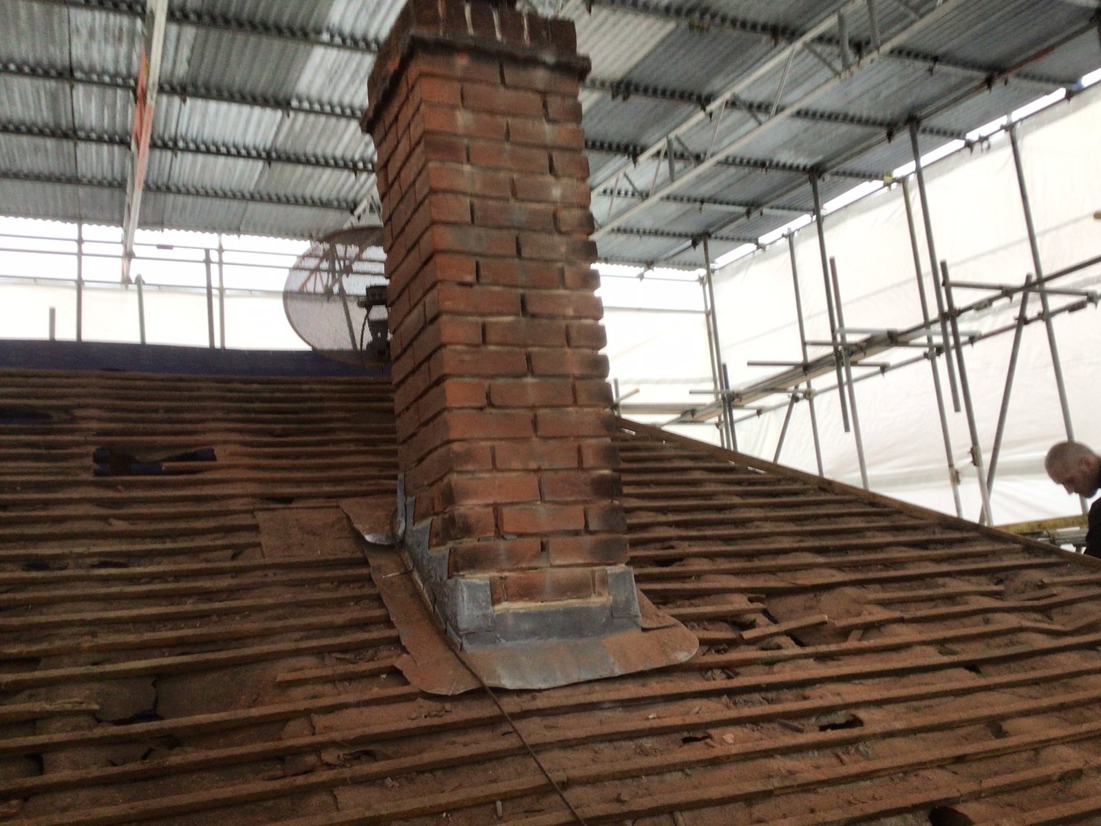 Chimney and roof works with scaffold