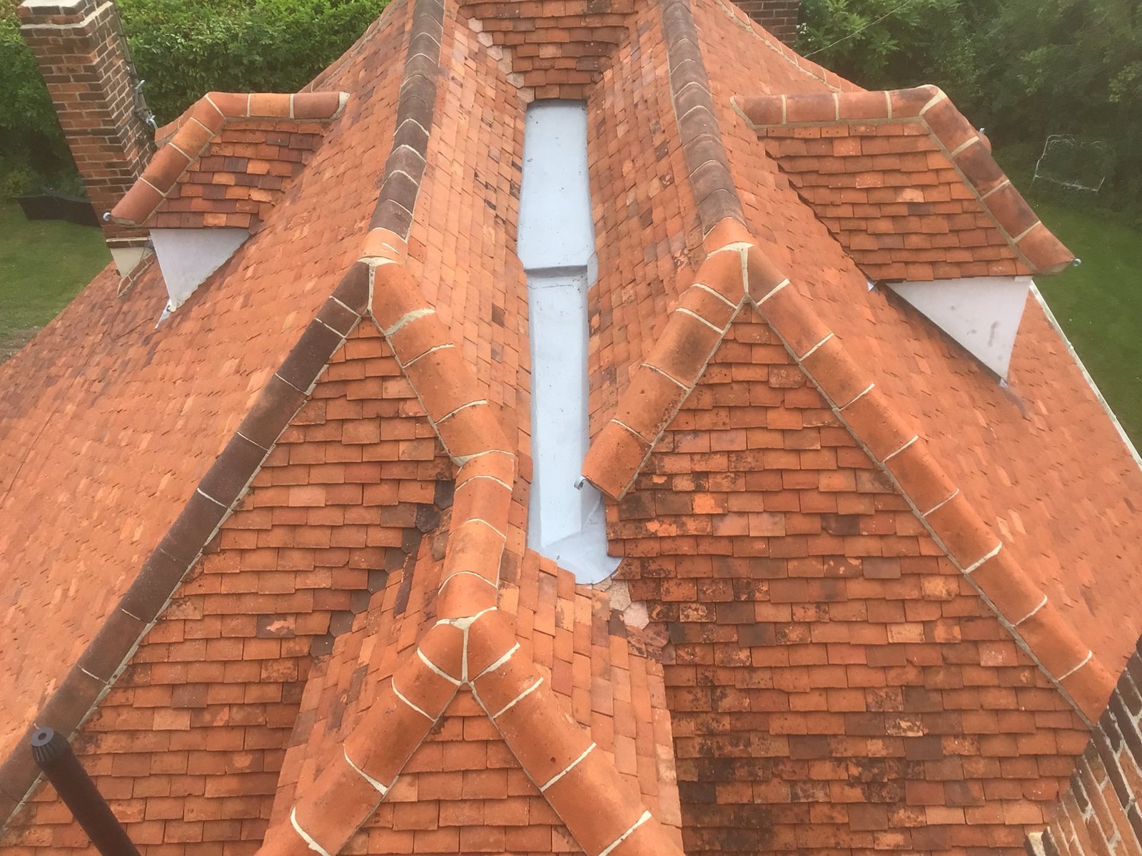 Finished new tiled roof with chimney