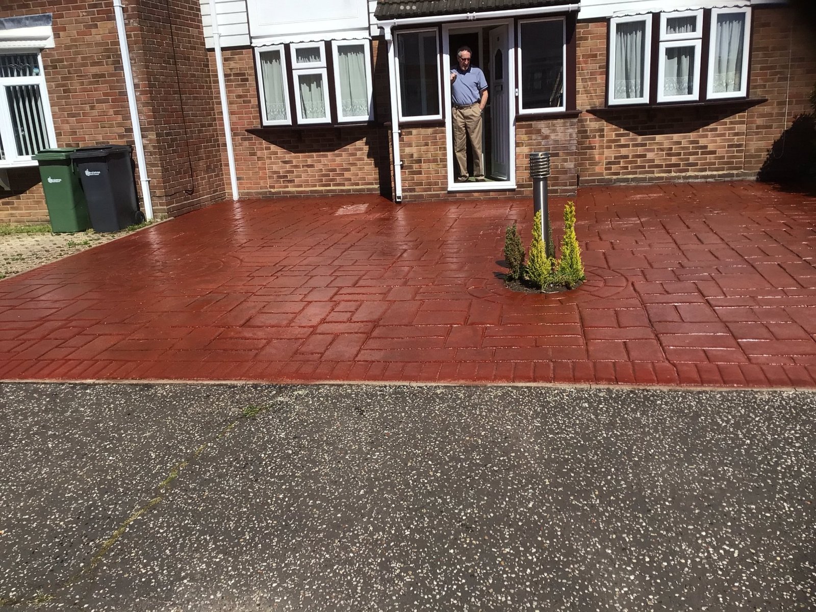 Restored red patio after cleaning and sealing